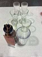All eight drinkware items grouped on table