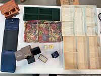 Group shot showing all items including Tiffany roll, Baume & Mercier boxes, trays and wooden organizers