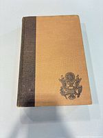 Front view of two-tone cloth-bound The Officer's Guide book
