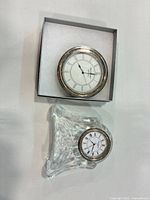 Crystal desk clock base with inserted clock and separate boxed insert shown