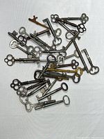 Pile of mixed antique skeleton keys showing quantity and variety
