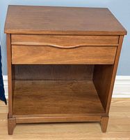 Front view of Kauffman Furniture night table showing drawer and shelf