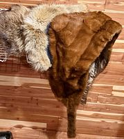 Full view of tan mink stole showing fox/coyote fur trim and satin lining