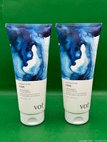 Front view of two identical hair masque tubes