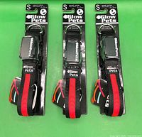 Front view of three packaged Glow Pets small LED collars