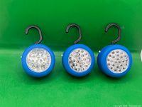 Three identical Lightway blue 24-LED work lights with hooks visible