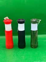 Front view of three flashlights showing colour variations and pull-out design