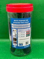 Front view of jar showing product label and red lid