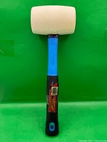 Full view of mallet front on green backdrop