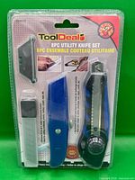 Front view of sealed ToolDeal 8-piece utility knife set in blister packaging