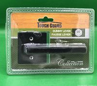Front view of sealed Tough Guard dummy lever door handle in retail packaging