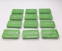 Front view of 11 visible green cases of crocodile paper clips