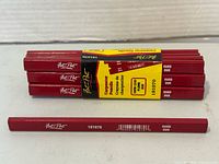 Stacked bundle of red Fat-Pat carpenter pencils with packaging label visible