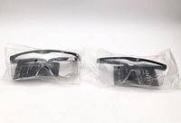 Two sealed safety goggles side by side