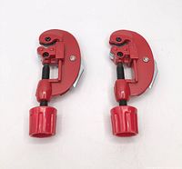 Pair of identical red tubing cutters front view