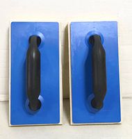 Front view of both sponge floats showing blue bases and black handles