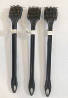 Three identical grill brushes front view