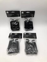 Front view of four sealed packs of Umbra brackets