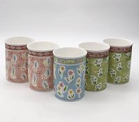 Front view of all five mugs displaying colour and pattern variations