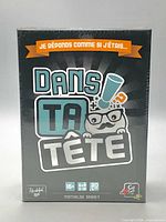 Front of sealed Dans ta Tête game box showing title, graphics, age 16+ icon, 20-minute icon