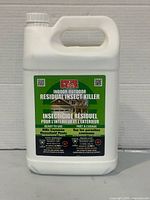 Full view of jug showing handle, cap and front label