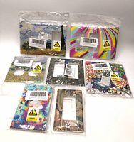 Group shot of all seven packaged decorative wall plates