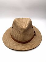 Front view of tan woven panama hat showing crown shape and band