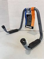 Front view of Stinson double arm hanger showing overall structure and padded hooks