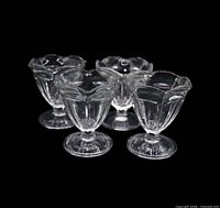Group view of four clear Fountainware low sherbet glasses