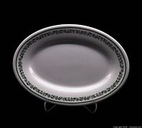 Front view of oval platter with green leaf border