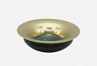 Top angled view showing brass rim and marble base