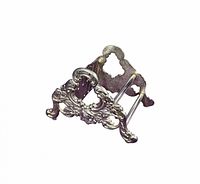 Angled view of Towle silver-plate utensil holder showing ornate floral sides