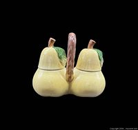 front view of assembled yellow pear condiment holder with two lids