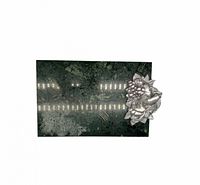 Top view of polished green granite board with pewter fruit motif