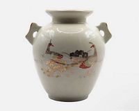 Front view showing peacock and floral decoration, handles, gold trim