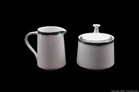Creamer and lidded sugar bowl front view