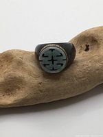 Top view showing jade plaque, black onyx band and gilt bezel