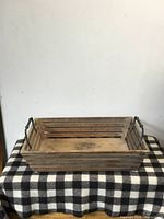 Tray angled view showing slatted sides and handles