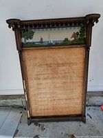 Full view of wood frame with reverse-painted glass panel