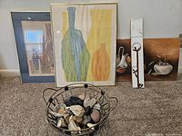 all four artworks and decorative bowl with stones visible together