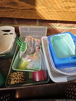 Group of assorted plastic trays and baskets in various colors and sizes