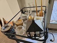 Full lot on cart showing candles, holders, lantern, bowls