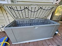 Rubbermaid deck storage chest open showing interior cargo net