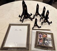 Group shot of six black plate holders and two Ashleigh Manor frames