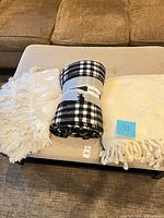 All three throw blankets displayed side by side