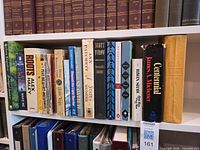 Full shelf showing entire lot of American fiction books