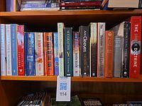 Shelf showing all 23 books with spines visible