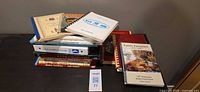 Stack of cookbooks on table