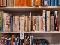 Shelf showing Symptoms A-Z, Time-Life medical reference set, The Soy Zone and additional health guides