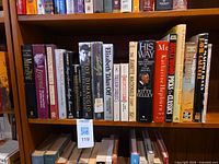 Shelf of Hollywood themed books with focus on Marilyn Monroe and other classic film personalities